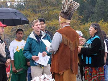 MCHT president Jay Espy hands Passamaquoddy Chief Rick Doyle the deed to the Picture Rocks lands in Machiasport.  As part of the agreement MCHT received a conservation easement on 300 acres of nearby Passamaquoddy land at Moose Snare Cove in Machiasport.